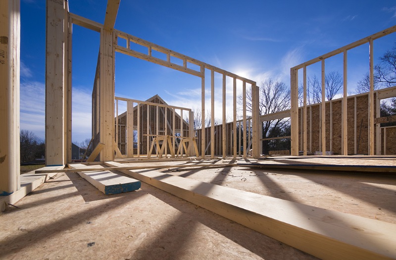 Construction site of a new house being built showing wood beams.