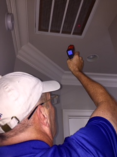 Wallace Preforming Interior Home inspection with laser thermometer